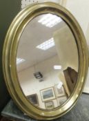 An oval brass framed vanity mirror and two other mirrors CONDITION REPORTS Brass vanity mirror has