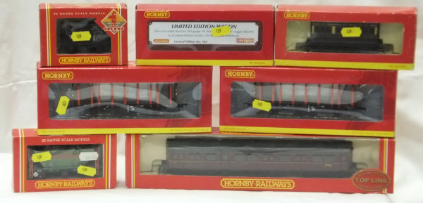 A collection of Hornby 00 gauge rolling stock including a limited edition Seven Plank wagon