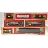 A collection of Hornby 00 gauge rolling stock including a limited edition Seven Plank wagon
