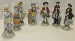 A collection of Dresden porcelain figures to include a pair depicting a gentleman with hound and
