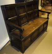 A 20th Century oak settle in the 17th Century manner,