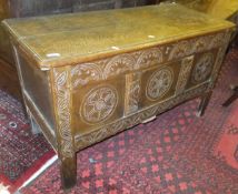 A 17th Century and later carved oak coffer,