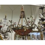 A gilt metal three branch ceiling light fitting of basket form with applied ceramic floral