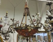 A gilt metal three branch ceiling light fitting of basket form with applied ceramic floral