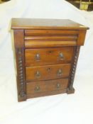 A Victorian mahogany miniature Scotch chest with cushion drawer above three long drawers flanked by