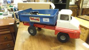 A vintage Tri-ang dumper truck, a Tri-ang Jones KL44 crane model (boxed),