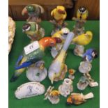 A collection of Dresden porcelain bird figures to include parrots, various garden birds, etc,