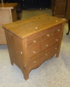 A pine chest of three long drawers,