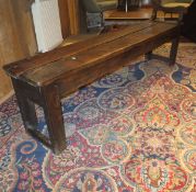 A French farmhouse inglenook bench in elm