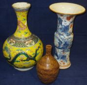 A Chinese porcelain gu vase with flared rim, painted in underglaze blue and with iron red and gilt