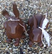 Two cast iron garden ornaments in the form of rabbits *