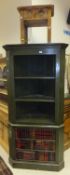 A modern painted pine corner cabinet with open shelving over two cupboard doors as books,