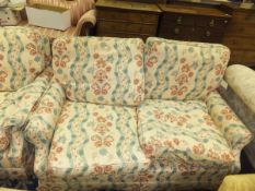 A Wesley-Barrell two seat sofa bed and single armchair in cream ground and foliate patterned