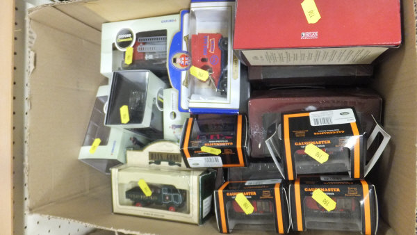 A box containing a collection of Oxford and Atlas fire engine models,