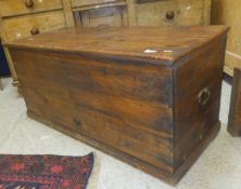 A Victorian pine trunk with brass carrying handles