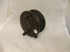 A 5" frog back centre pin fishing reel with twin handles and Heaton's latch CONDITION