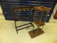 An early 20th Century mahogany boot rack with brassed handle,
