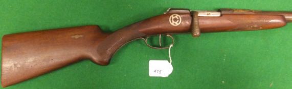 A 12 bore bolt action shotgun with single 30½" barrel, bears "OKC" inlaid medallion to stock (No.