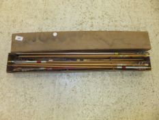 A box containing a collection of vintage arrows,