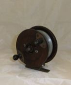 An unusual wooden reel with ball bearing fulcrum and shaped spine back CONDITION REPORTS
