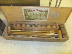 A pine cased croquet set,