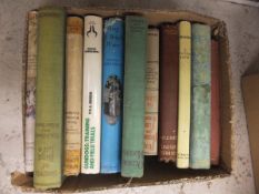 Three boxes of sporting-related books, to include B. W. R.