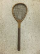 A vintage ash and inlaid tennis racket of small proportions (possibly a squash racket) with cat gut,