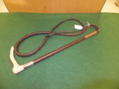 A Swaine ladies riding crop with antler handle and plaited leather shaft,