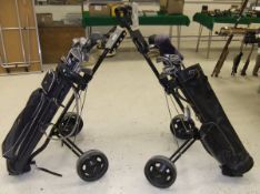 Two bags of golf clubs,