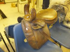 A vintage leather side saddle with three pommels