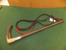 An antler handled riding crop with plaited string bound shaft and steel lined ferrule with plaited