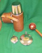 A box containing two Holland and Holland circular silver plated and brass hip flasks,