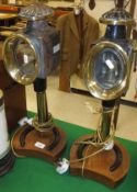 A pair of coaching lamps mounted on horseshoe bases as table lamps