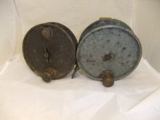 Two 5½" sea fishing reels, one with brass foot inscribed "The Neptune",