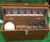 A mahogany rectangular picnic drinks cabinet, the top containing six glasses,