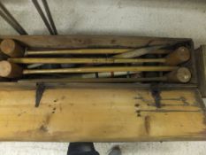 A pine cased croquet set