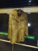 A three quarter length coney fur jacket