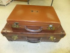 WITHDRAWN A vintage brown leather suitcase, bearing initials "FPH",