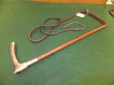 A ladies riding crop with antler handle, plaited leather shaft and a plated ferrule,