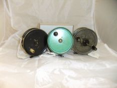 Three fishing reels, to include an Alex Martin 3½" fly reel,