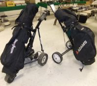 A powered golf trolley, a further golf trolley, a set of left handed golf clubs, a hard flight case,