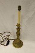 A 19th Century gilt bronze candlestick in the Empire taste,