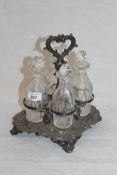 A Victorian silver cruet with acanthus and floral decoration, raised on four scrolling feet,