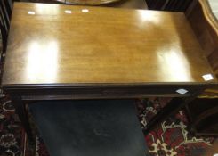 A mahogany rectangular topped card table, the top opening to reveal green baize,