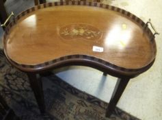 A kidney-shaped mahogany tray topped table with marquetry inlaid top,