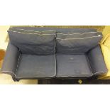 A two seater sofabed in blue denim effect upholstery