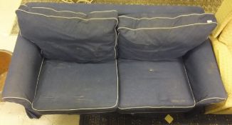 A two seater sofabed in blue denim effect upholstery