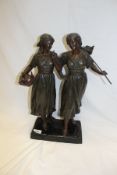 A circa 1900 patinated spelter figure group of two Dutch peasant girls