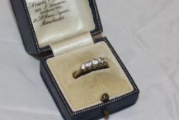 An 18 carat gold five stone set ring