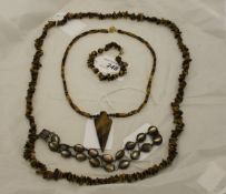 A tiger's eye necklace and similar bracelet,